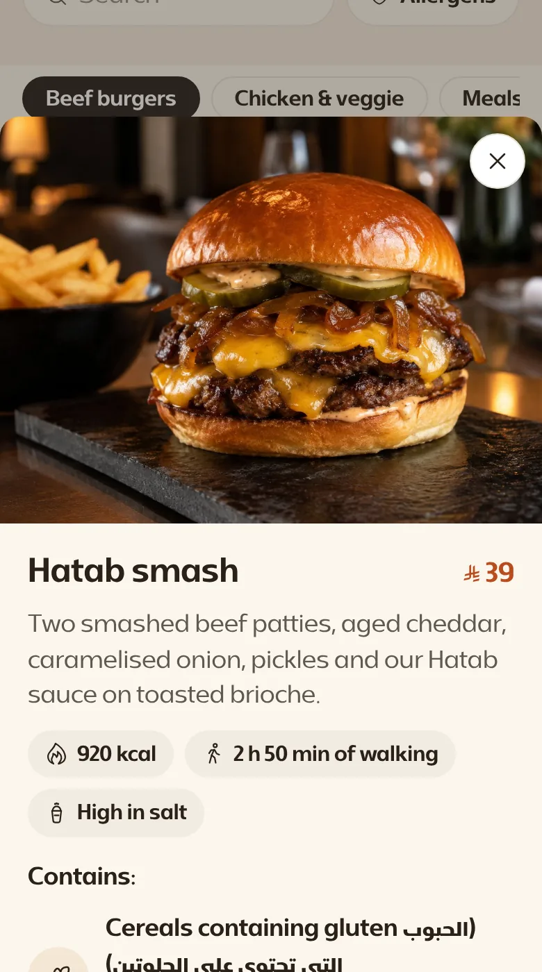 A dish's card opened: its photo large, its price, calories, minutes of walking and allergens