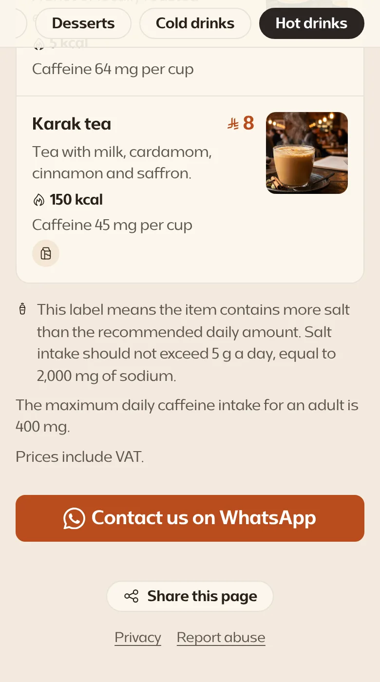 The bottom of the menu and its Contact us on WhatsApp button